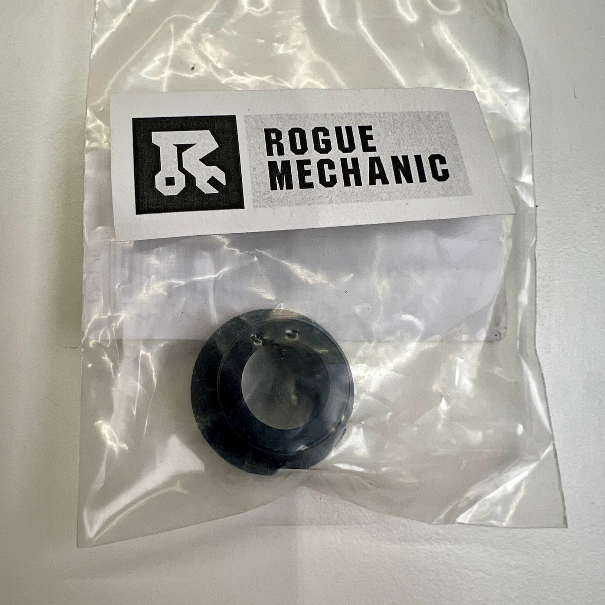Mavic rear QRM auto axle adapter packaged in a clear plastic bag with a label that includes the Mavic and Rogue Mechanic brand logos, as well as product information. Mavic Rear QRM Auto 12x135mm Axle Adapter V2510901